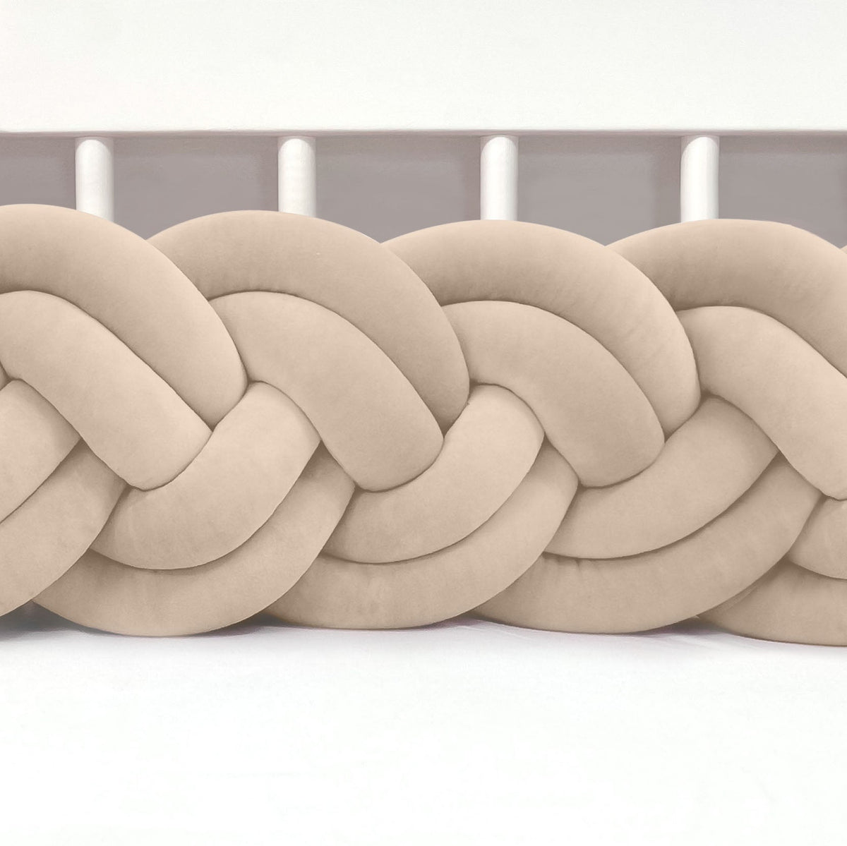 Beige braided rope on a white background