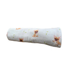Baby NaturHere maxi muslin swaddle blanket with French bulldog print and green leaves on a light blue background. Made of 100% cotton.