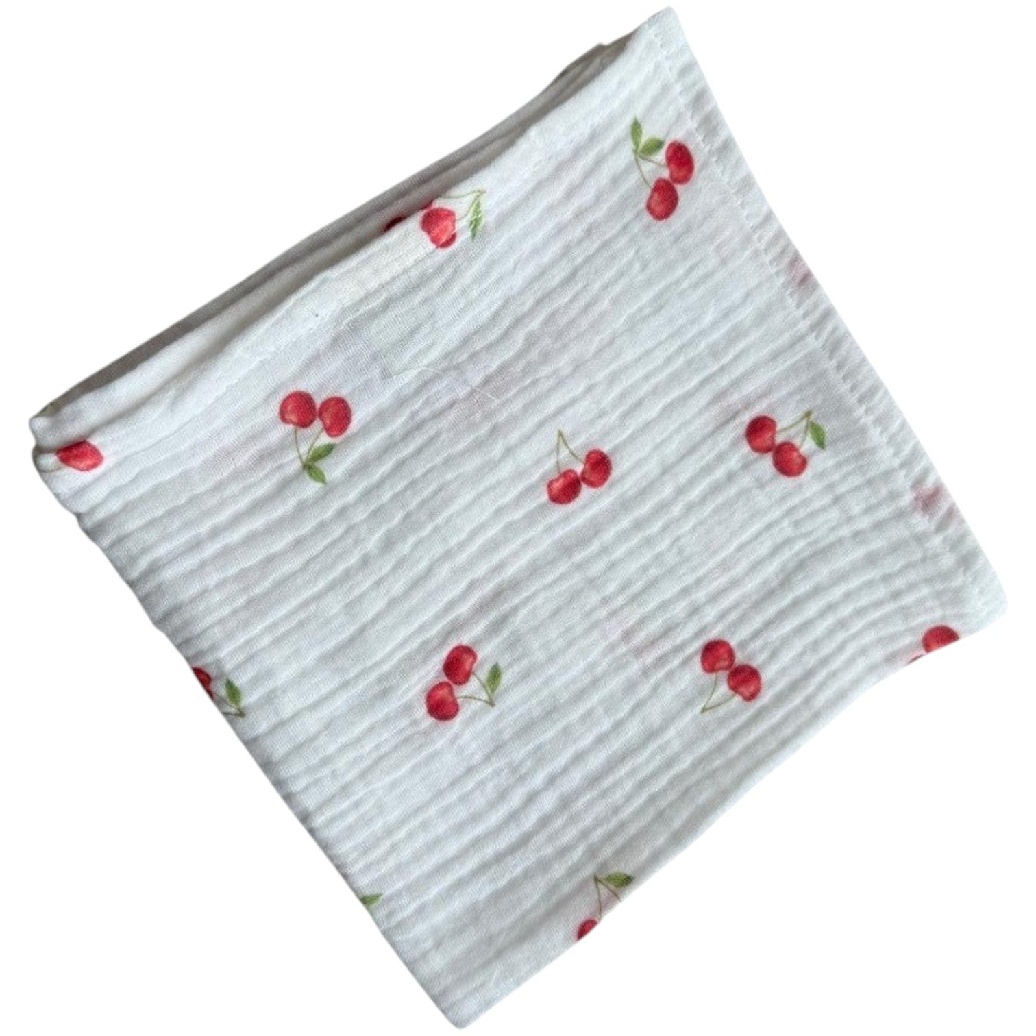 Baby Natur white muslin cloth with a red cherry print. Made from 100% cotton, perfect for babies.