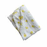 Baby Natur white 100% cotton crib sheet with a yellow lemon print. Soft, breathable, and washable.