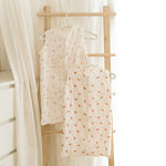 Baby Natur sleeveless sleeping bags in cream with cherry and floral prints. Made from soft, breathable cotton.