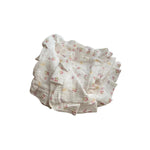 Baby NaturMuslin swaddle blankets with a delicate floral print in pink and yellow on a white background. Soft and breathable.