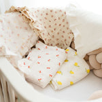 Baby NaturMuslin swaddles with cherry, lemon, and floral prints. Soft, breathable, and perfect for nurseries.