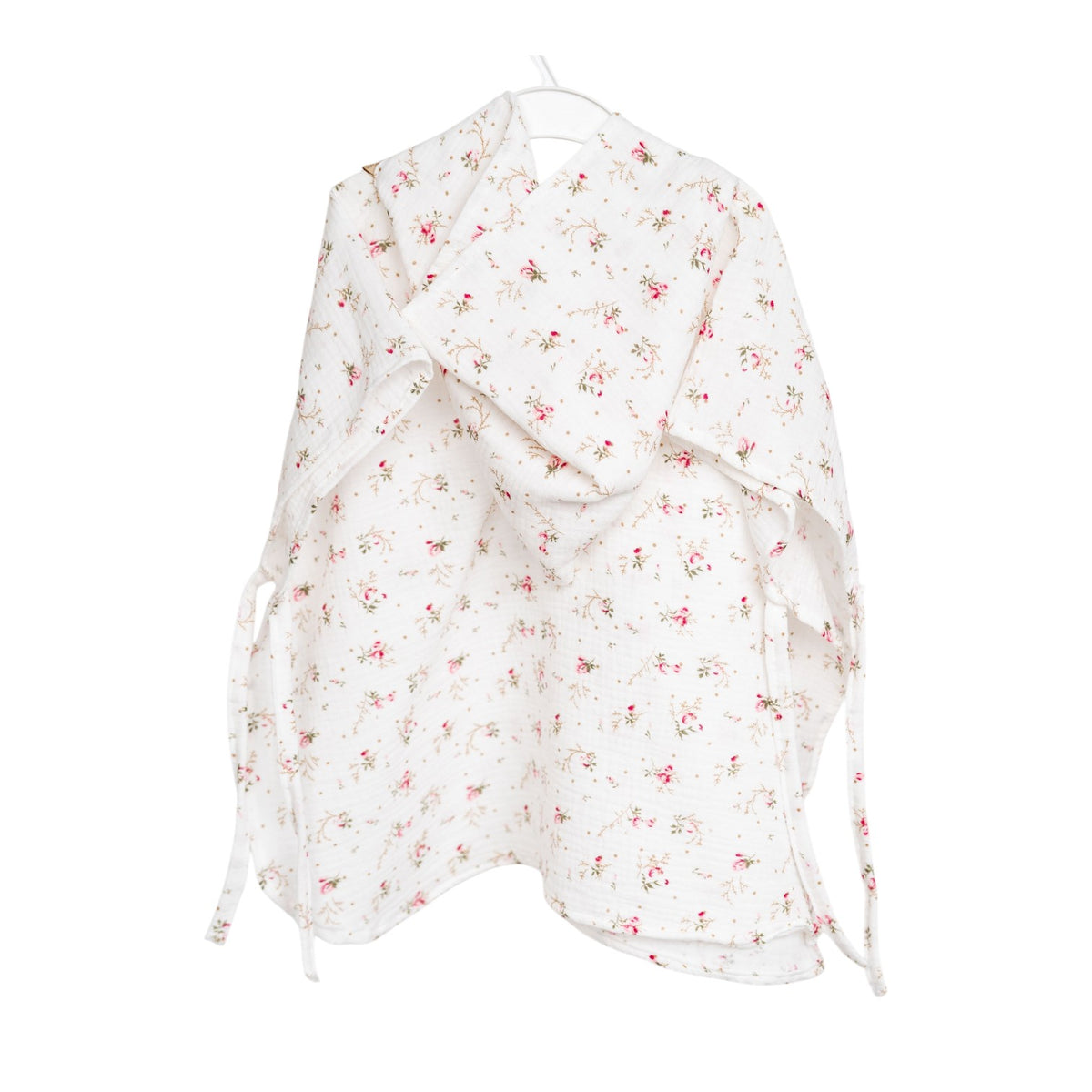 Baby Natur white muslin poncho with pink floral print and hood. Ties at the sides.