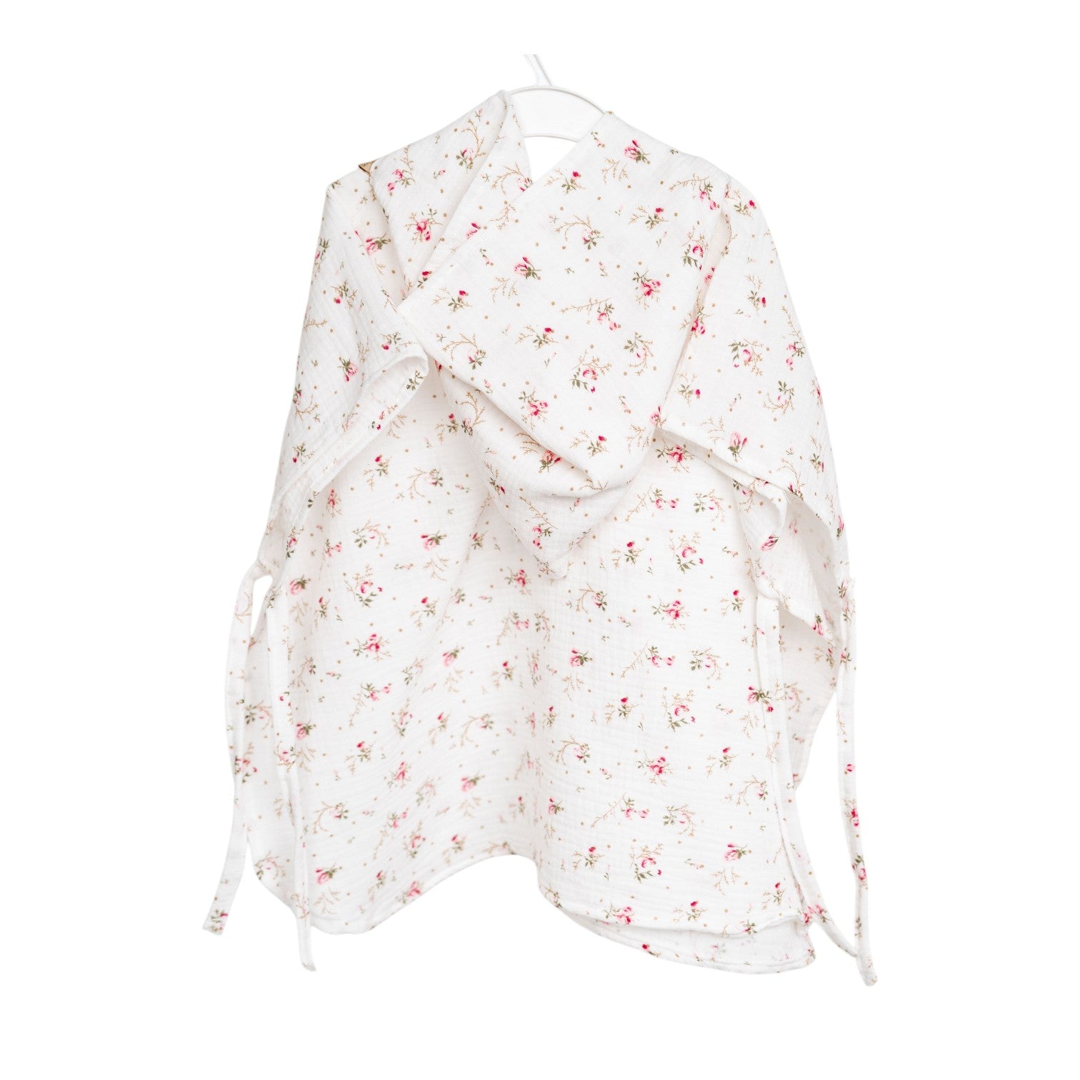Baby Natur white muslin poncho with pink floral print and hood. Ties at the sides.